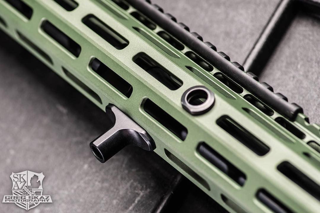 Black Arisaka Finger Stop M-Lok installed on an olive drab M-Lok handguard