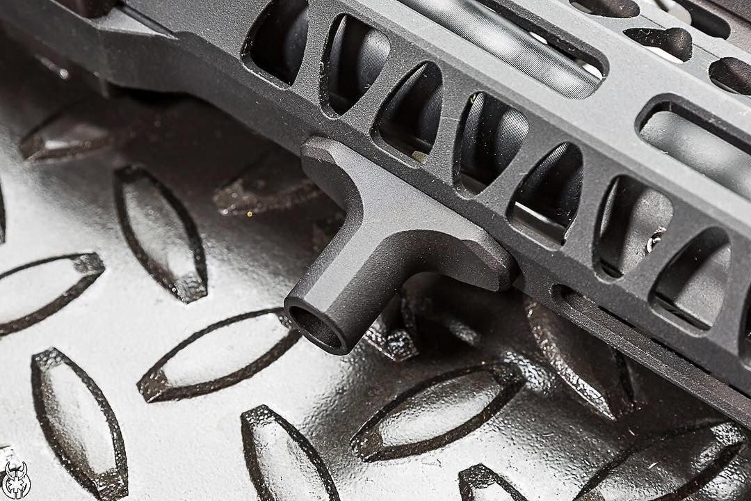 Black Arisaka Finger Stop M-Lok mounted beneath an M-Lok handguard