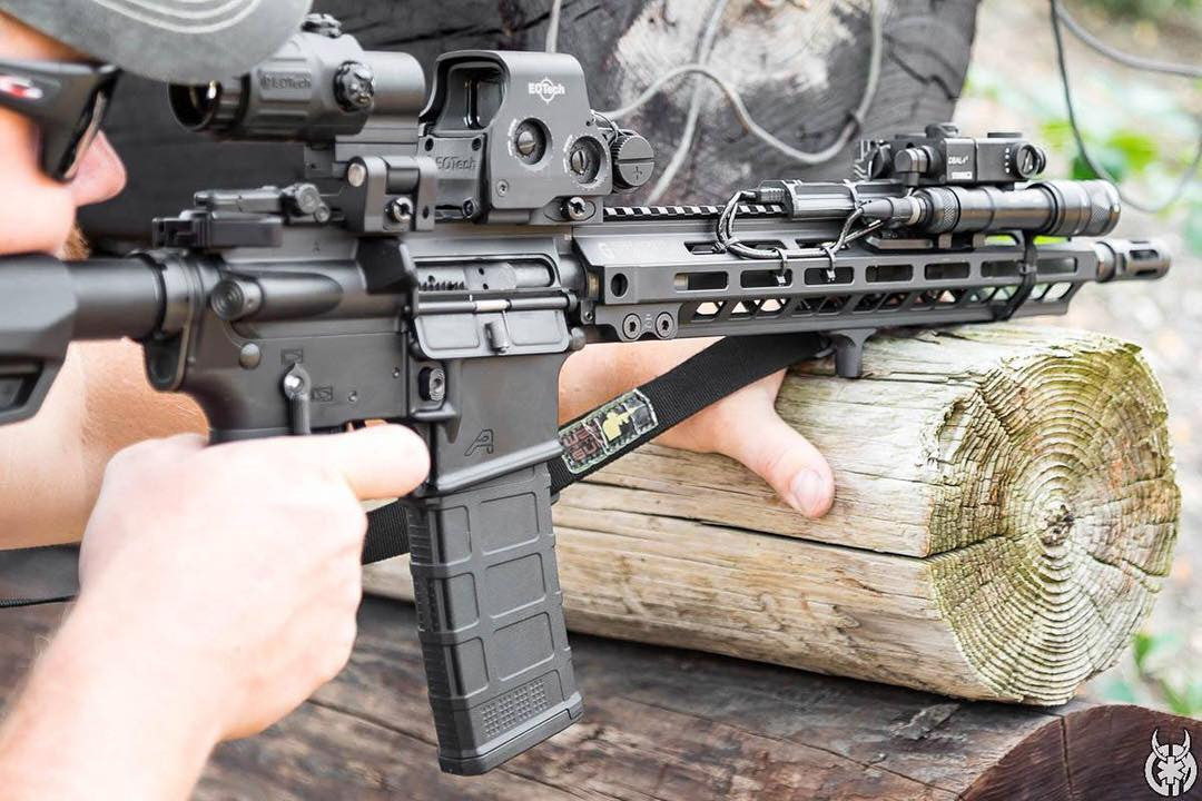 Arisaka Finger Stop M-Lok in black installed on an M-Lok handguard at a shooting range