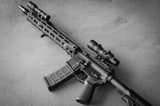 Arisaka Finger Stop M-Lok in black installed on a complete rifle