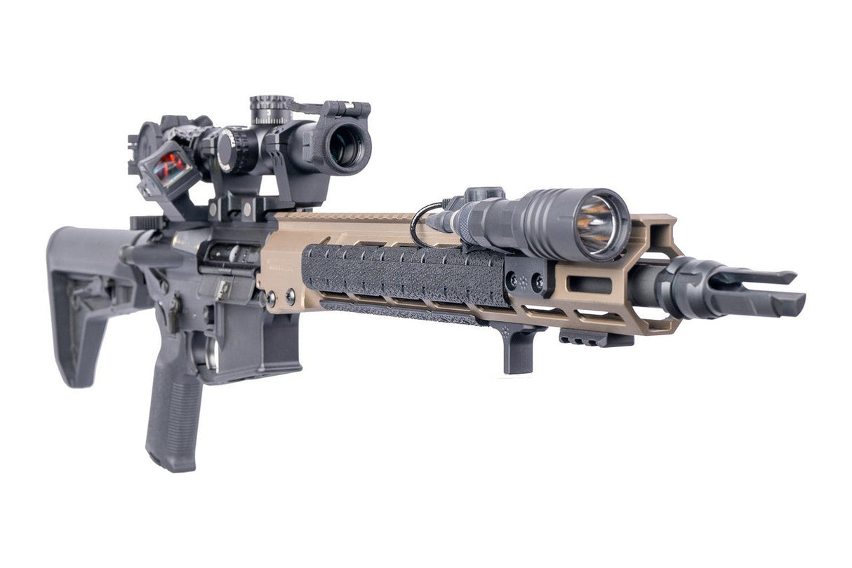 Arisaka Indexer M-Lok in black installed on a rifle with a Flat Dark Earth handguard