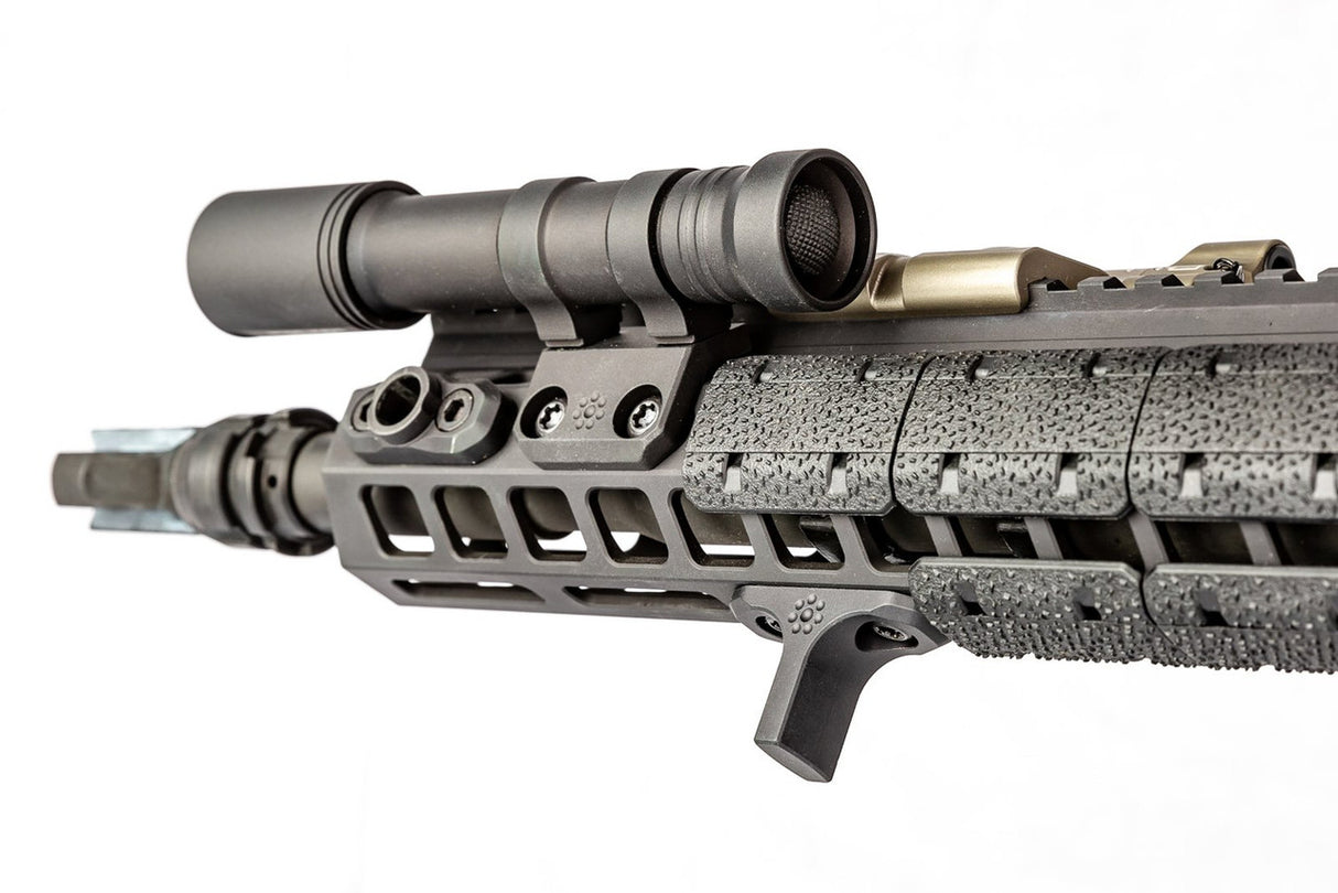 Black Arisaka Indexer M-Lok mounted on a Flat Dark Earth handguard