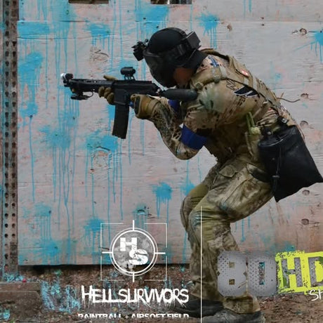 Nightmare PB in tactical gear aiming his EMF200 during a magfed paintball game at Hell Survivors field.