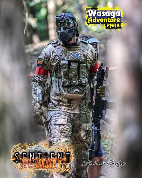 Nightmare PB walking with EMF200 marker at Sentient Reboot event, wearing tactical vest and mask at Wasaga Adventure Park.